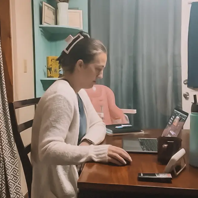 A mom working during her morning routine.