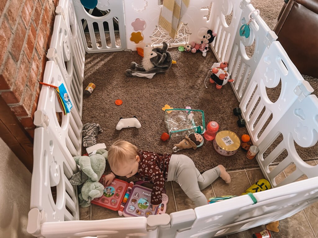 A safe play area for toddlers to play while mom works.