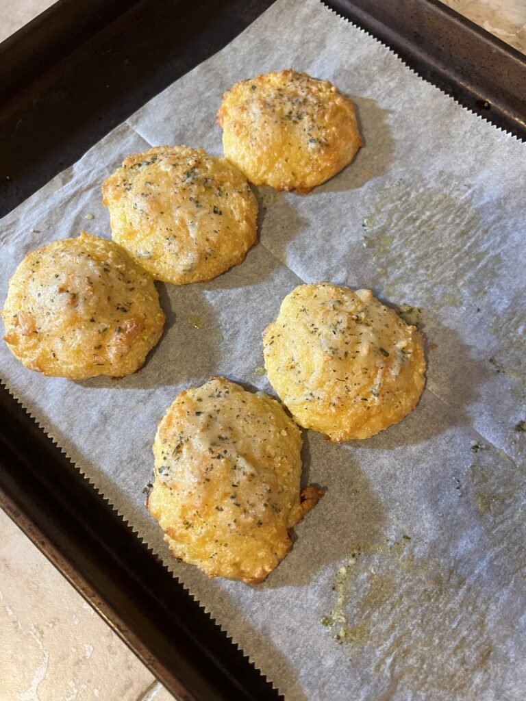Freshly baked, low-carb, cheddar biscuits. A delicious keto-friendly side.