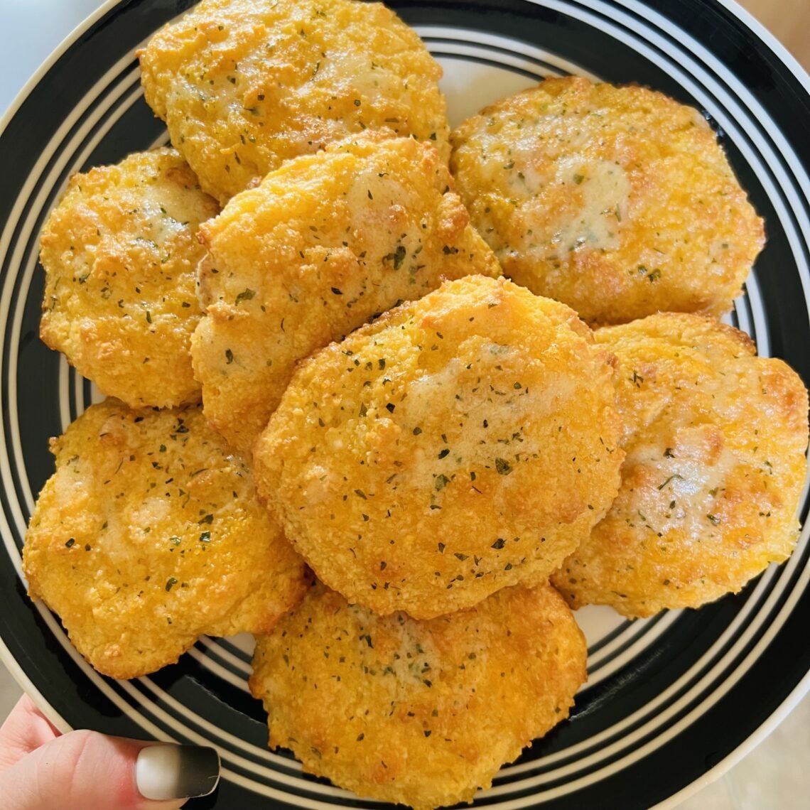 Freshly baked, low-carb, cheddar biscuits. A delicious keto-friendly side.