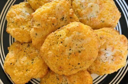 Freshly baked, low-carb, cheddar biscuits. A delicious keto-friendly side.