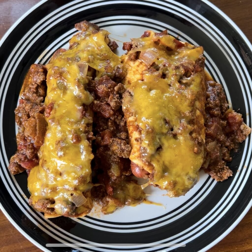 A plate of yummy keto chili cheese dog casserole.