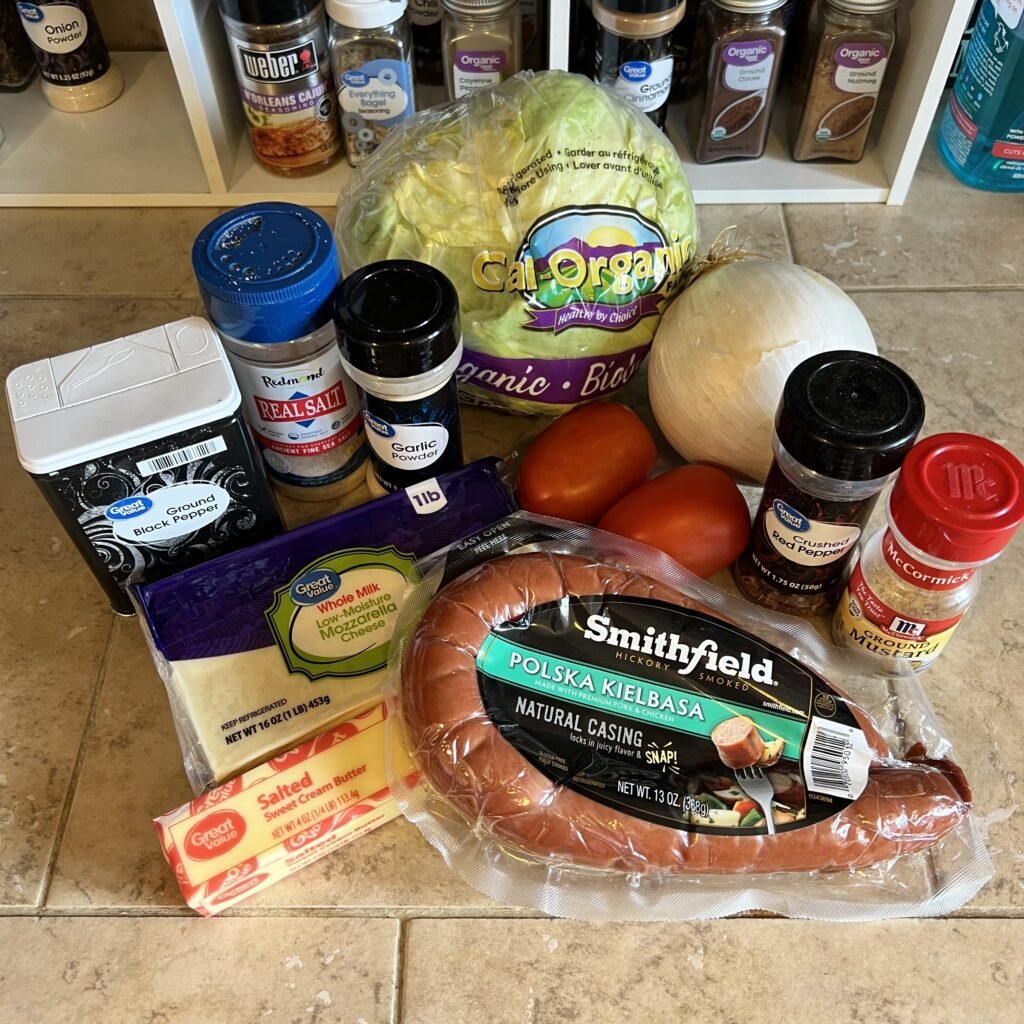 Ingredients to make a cheesy keto kielbasa cabbage skillet.