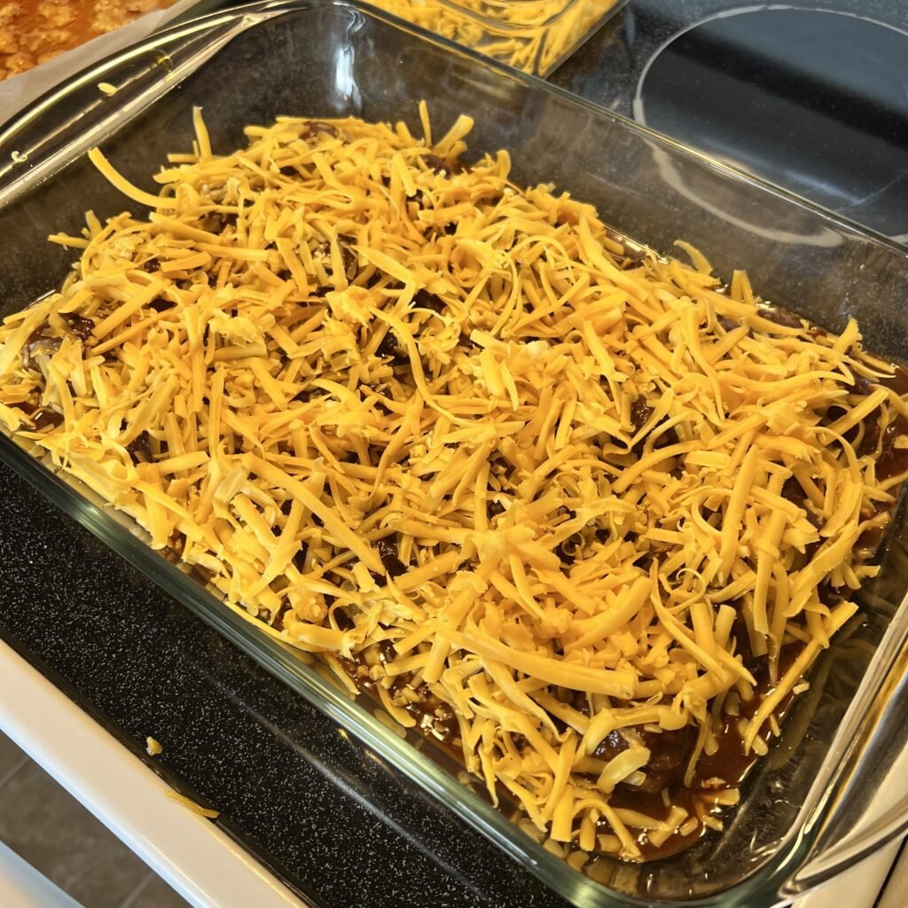 Cheesy Keto Enchilada Meatball Bake prepared and ready to go into the oven.