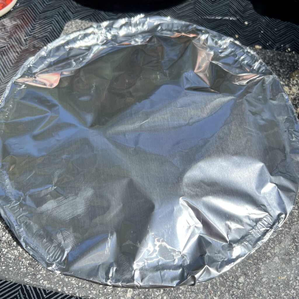 Cover your campfire french toast with aluminum foil before placing on the fire pit grate.
