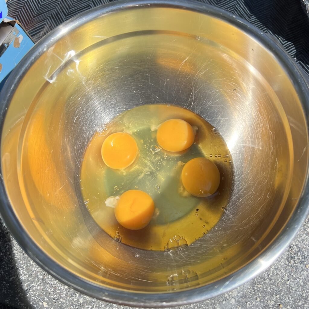 Cracked eggs in a bowl for french toast.
