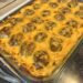 A delicious baked cheesy keto enchilada meatball casserole.