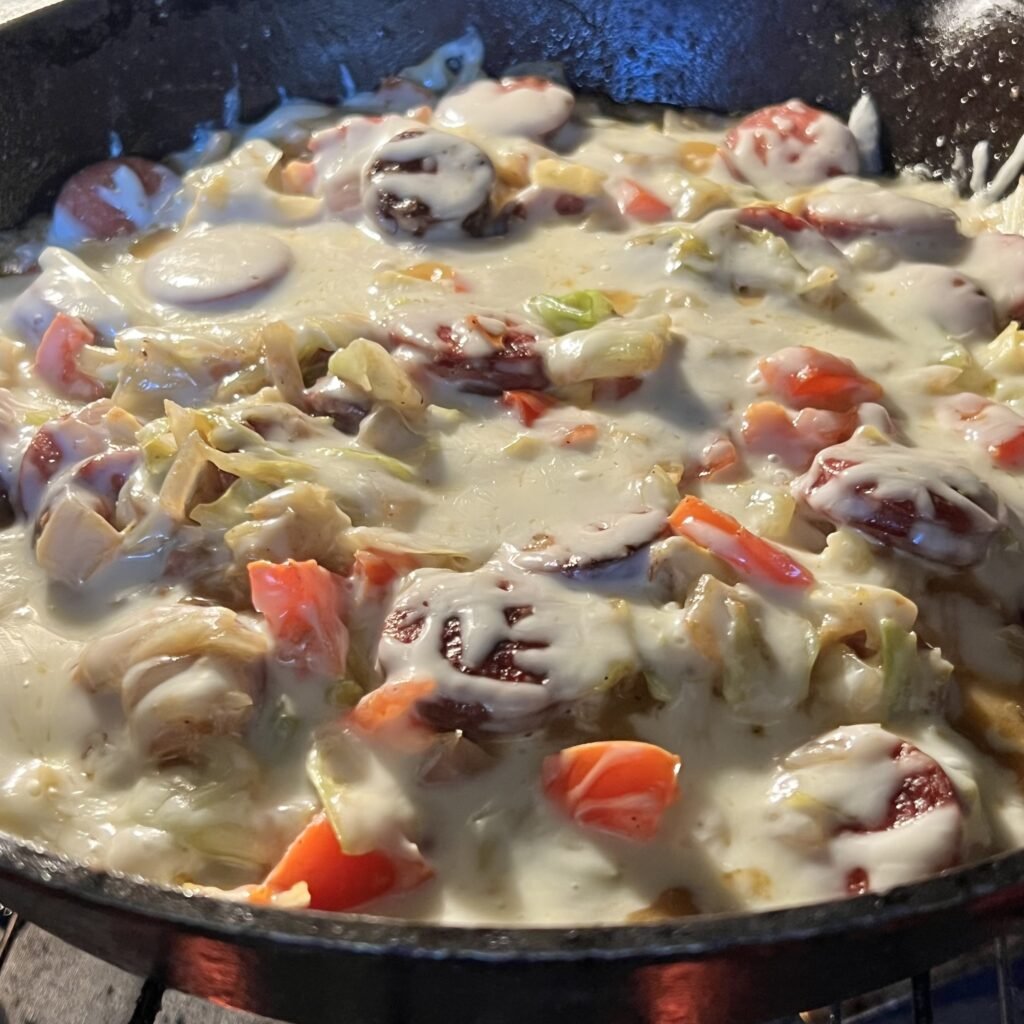 One pan skillet dinner. Cheesy Keto kielbasa sausage and cabbage.