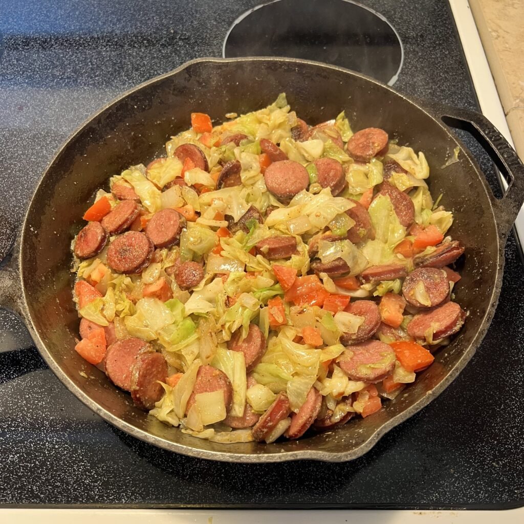 Seasoned cabbage tomato and kielbasa sausage.