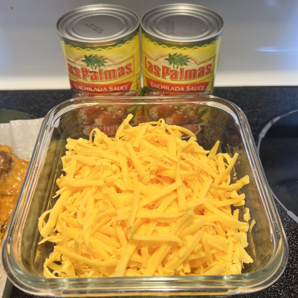 Las Palmas enchilada sauce and shredded sharp cheddar cheese.