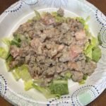 Cream BLT ground beef skillet served over a bead of fresh romaine lettuce.