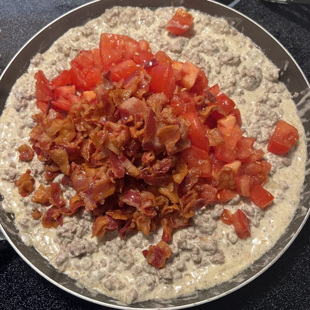 Making a creamy BLT ground beef skillet.