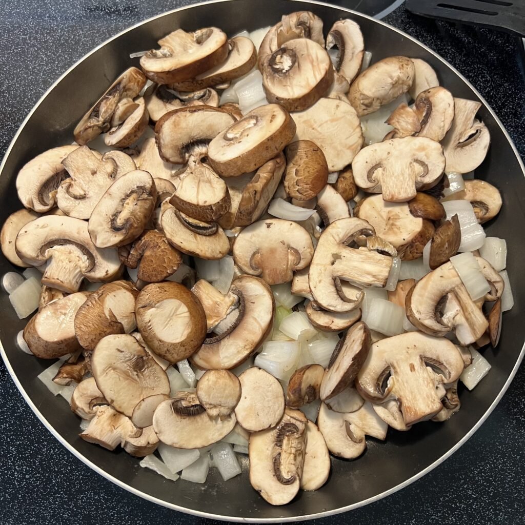 Preparing the onions and mushrooms for a tasty ground beef stroganoff dinner