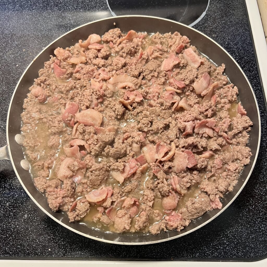 Prepared bacon and beef to go in a carnivore casserole.