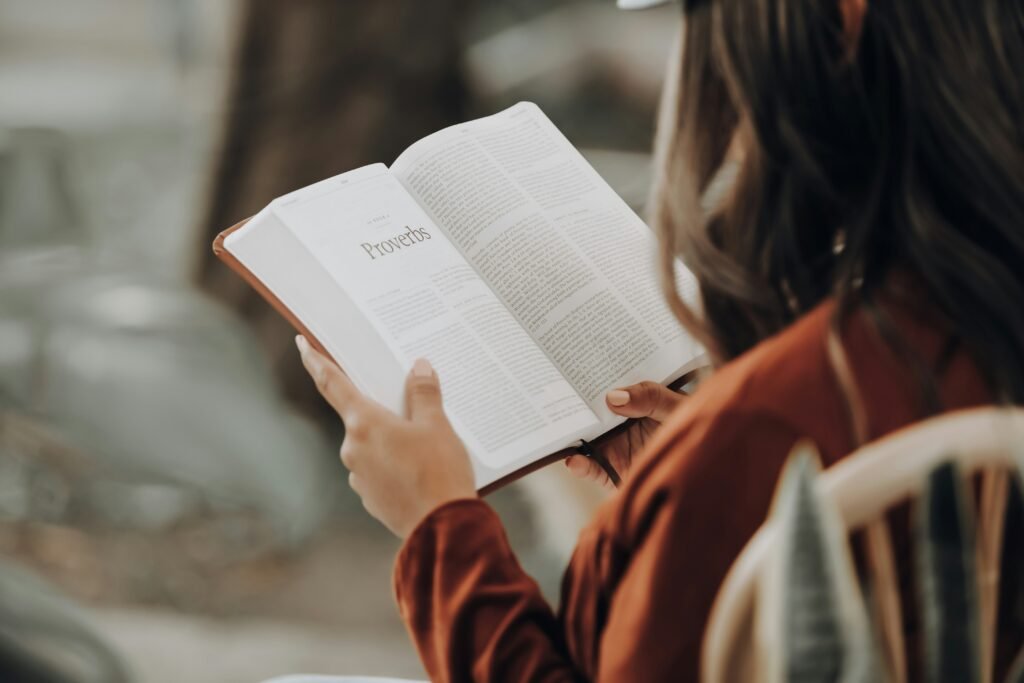 Reading the book of Proverbs in the Bible.