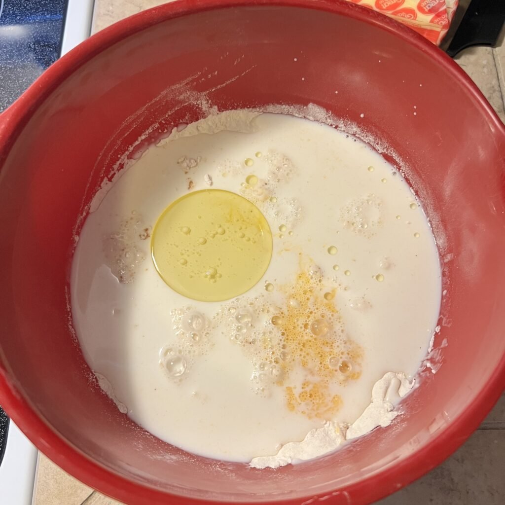 Making the batter for fluffy sourdough discard pancakes