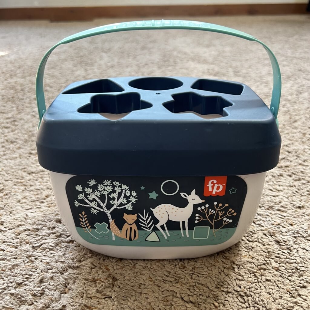 A side view of the Fisher Price Baby's First Blocks Set toy.