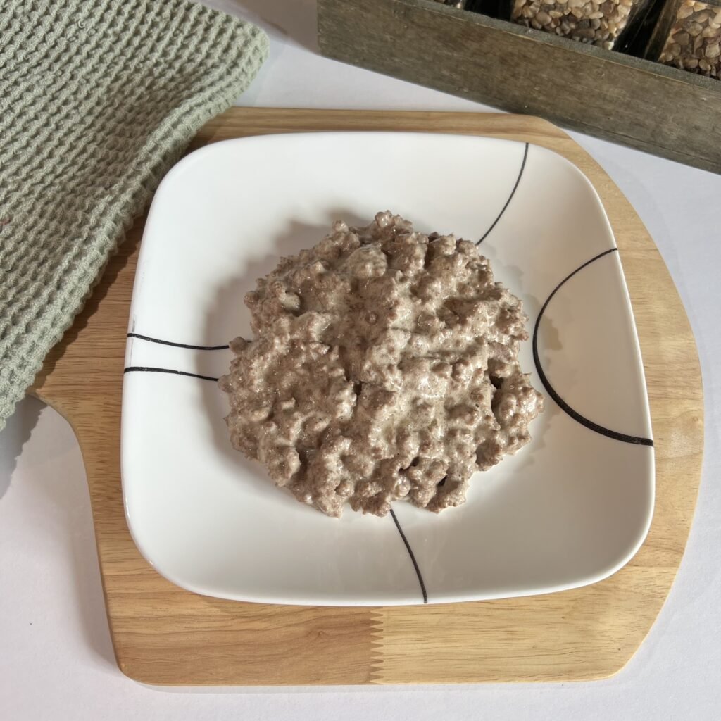 Overhead shot of a plate of freshly cooked Alfredo ground beef.