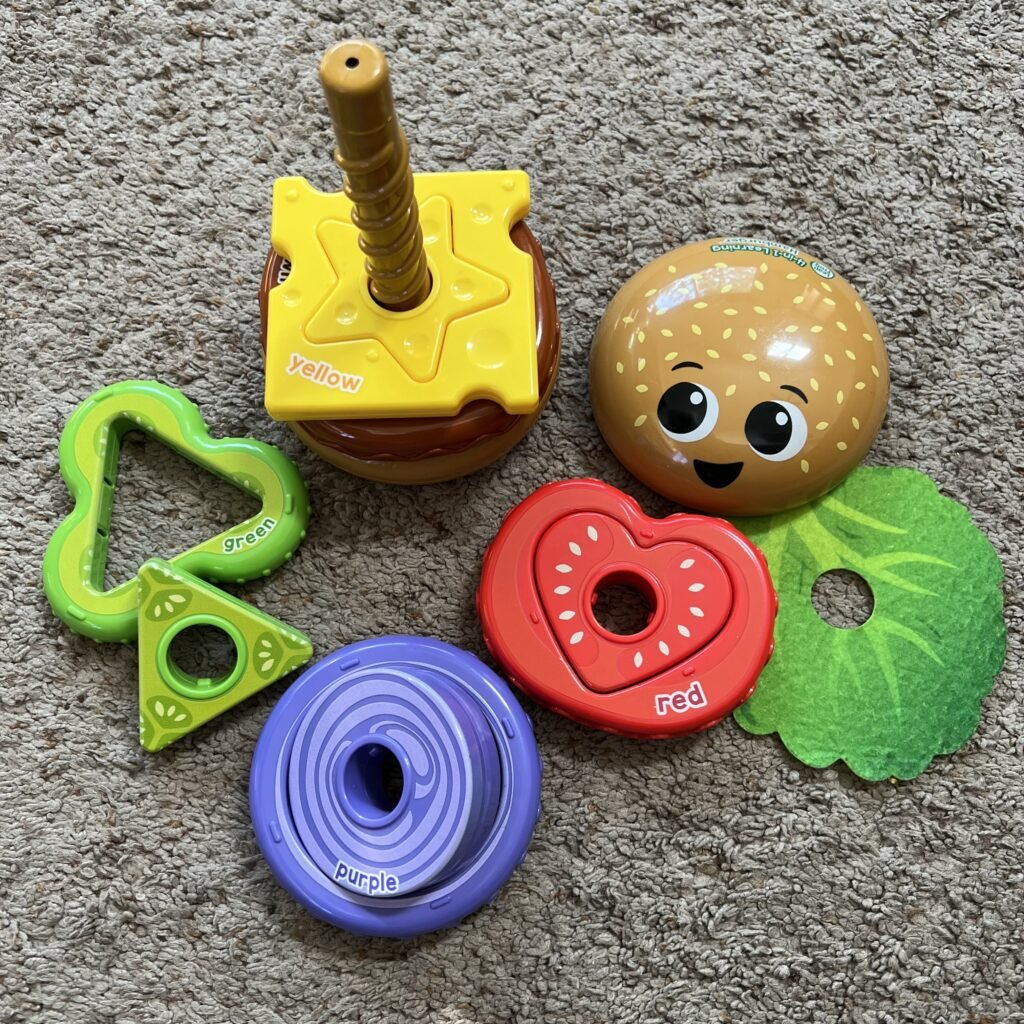 All the pieces of the Leap Frog 4-in-1 Learning Hamburger.