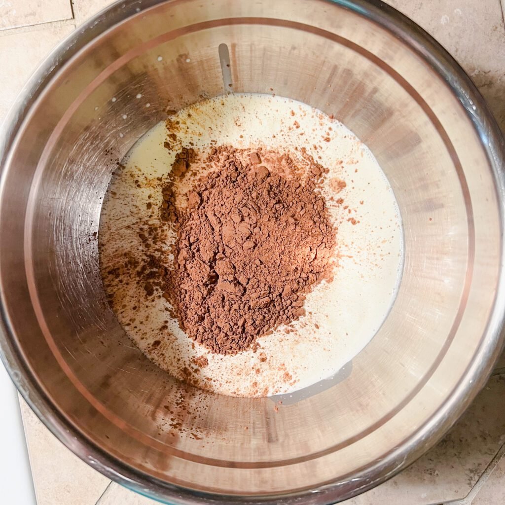 A large mixing bowl with the 3 ingredients needed to make clean chocolate mousse.
