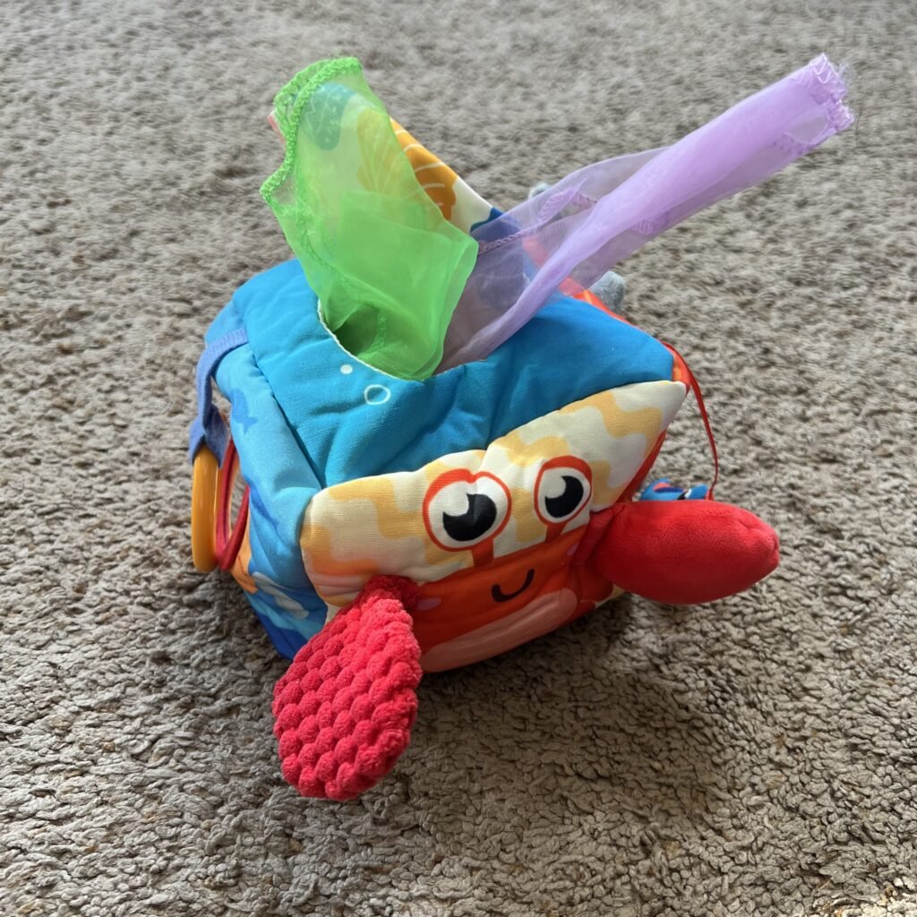 This Baby Tissue Box Toy helps toddlers learn through color, various textures, and play.