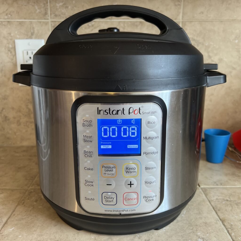 An Instant Pot pressure cooking medium sized chicken breasts for 8 minutes.