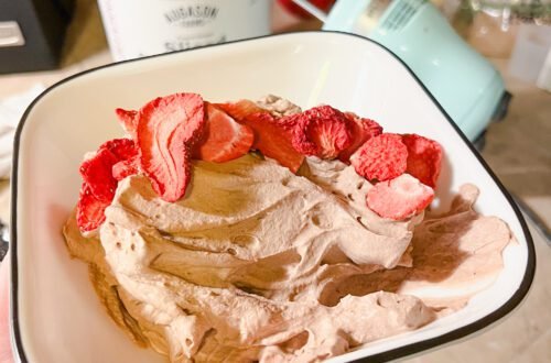 A delicious bowl of clean chocolate mousse served with freeze dried strawberries. A delicious, clean, and family-friendly dessert!
