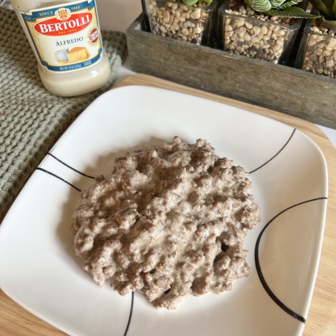Overhead shot of a plate of delicious Alfredo ground beef. This is a quick and easy 2-ingredient skillet meal that is sure to please!