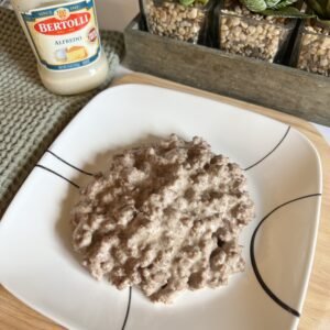 Overhead shot of a plate of delicious Alfredo ground beef. This is a quick and easy 2-ingredient skillet meal that is sure to please!