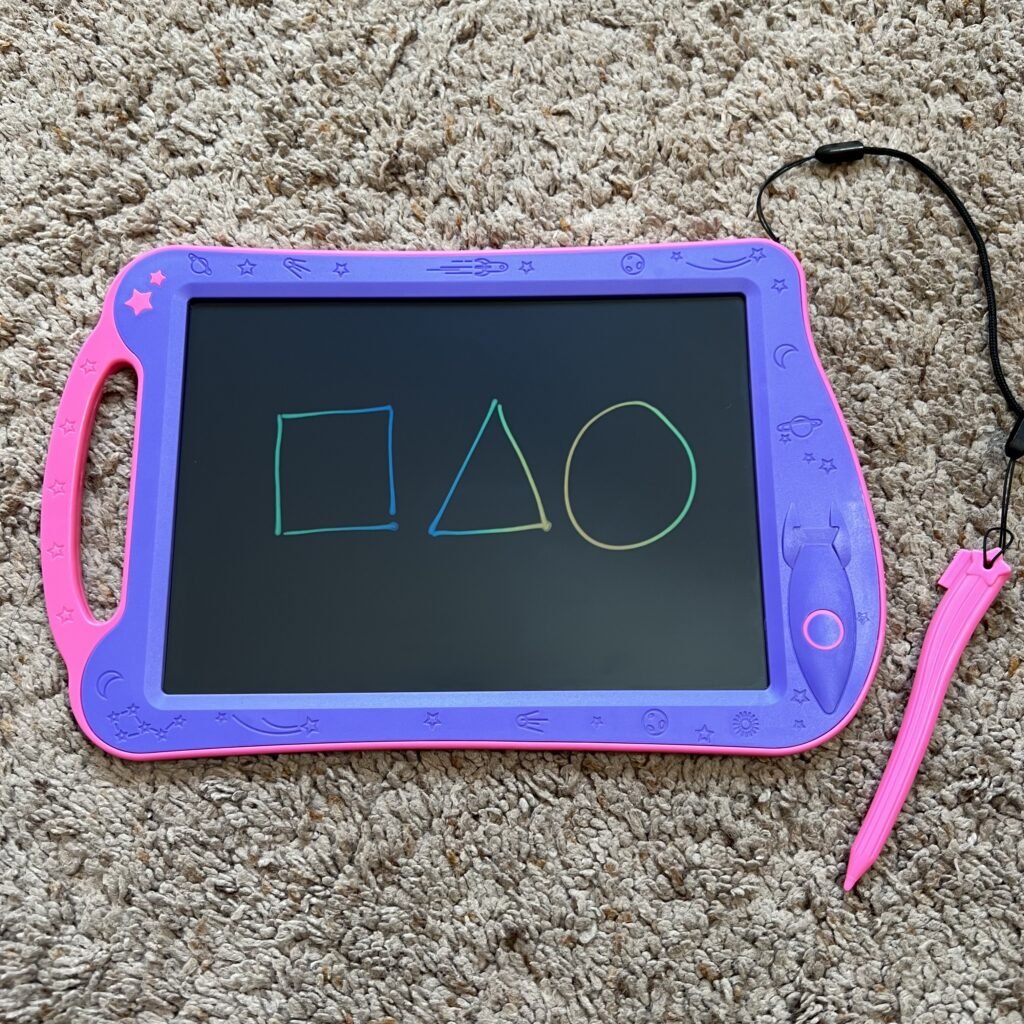 A square, triangle, and circle drawn on the screen of the Astrodraw drawing pad, an ink-free drawing pad for toddlers.