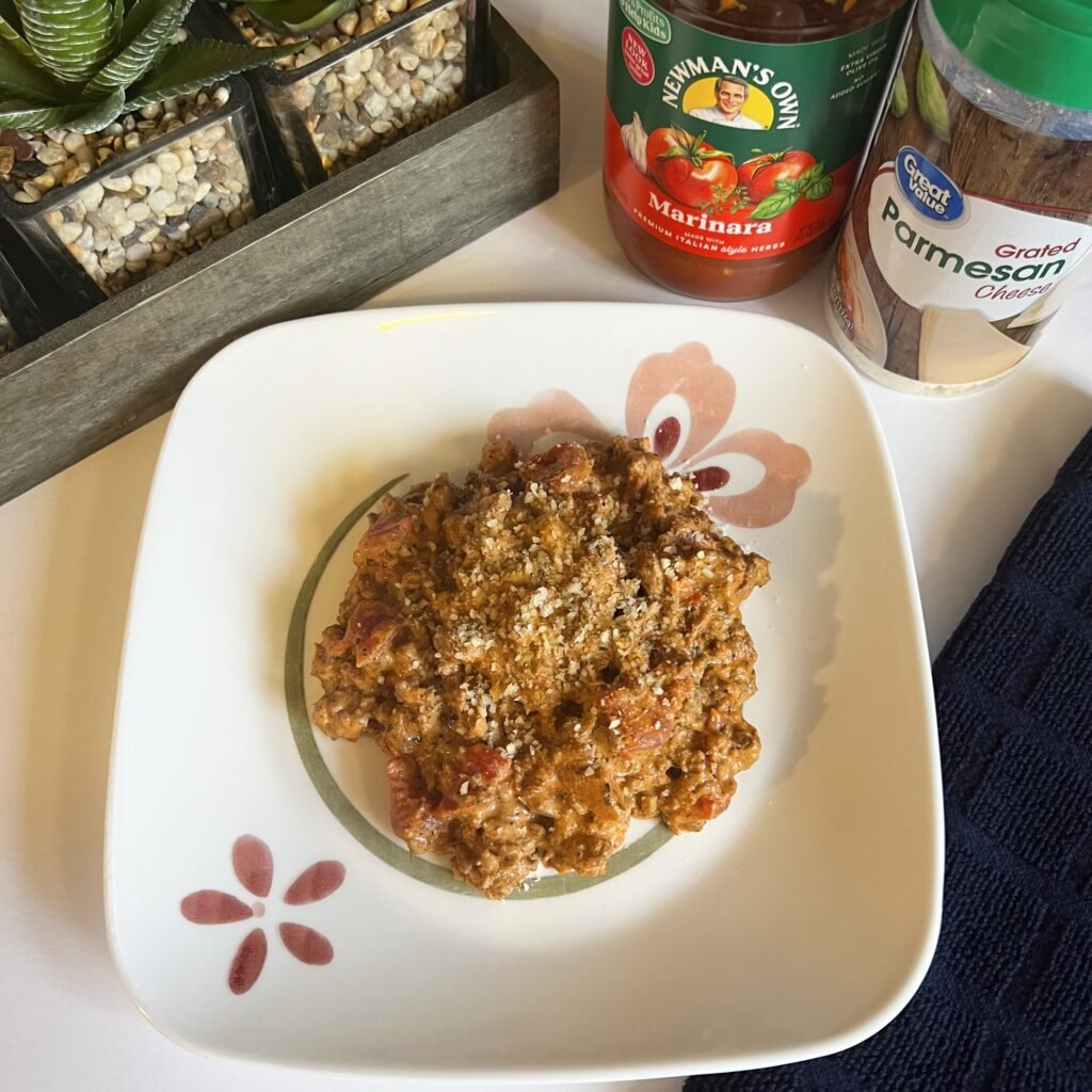 An overhead shot of this delicious and keto-friendly creamy ground beef with tomatoes and marinara. Serve it with some grated parmesan cheese for the finishing touch.