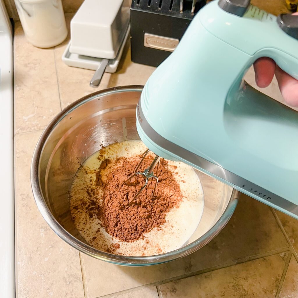 Using a KitchenAid hand mixer to make delicious 3-ingredient chocolate mousse.