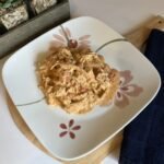 A delicious plate of creamy shredded chicken with Rotel ready for family dinner.