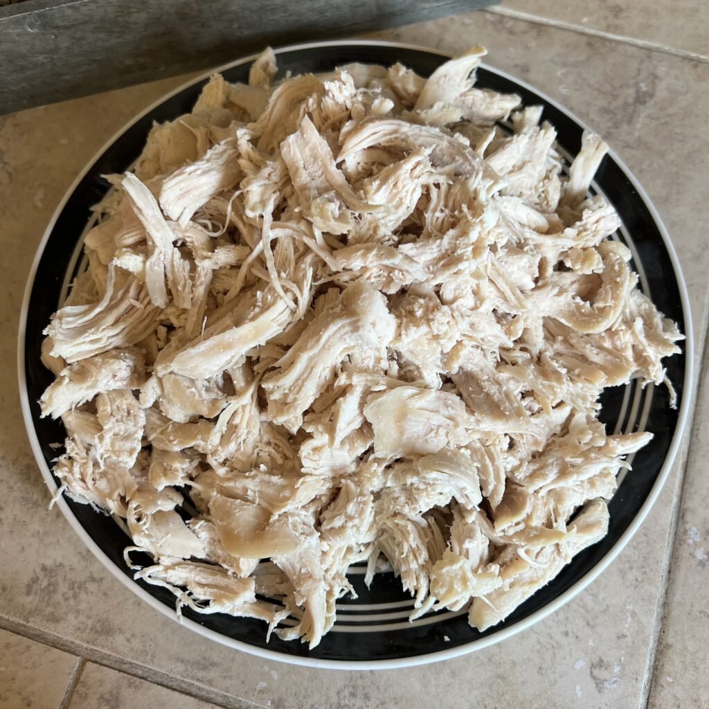 A delicious plate of shredded chicken. These were medium sized chicken breasts that were pressure cooked for 8 minutes and then shredded.