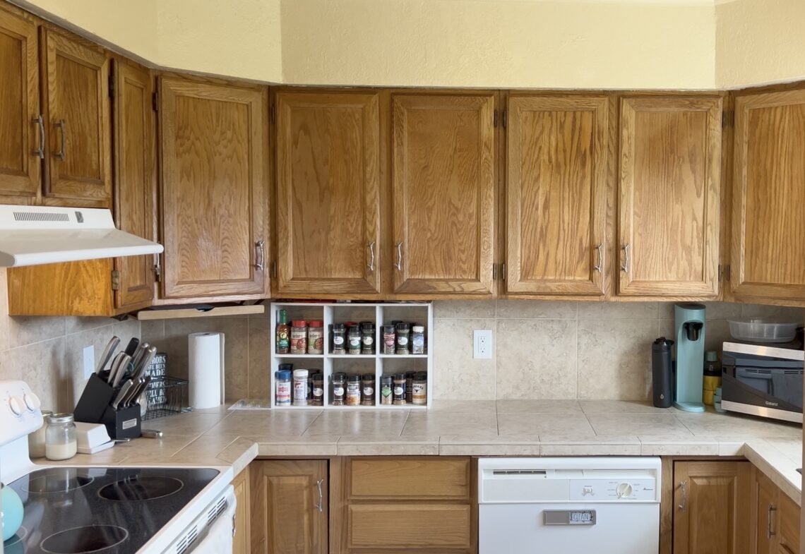 A picture of a clean and organized kitchen. The feature photo for my Kitchen Essentials for Moms blog post.