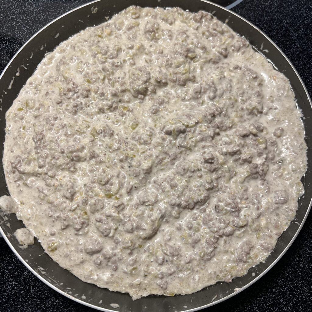 A close-up shot of a delicious Creamy Salsa Verde Ground Beef Skillet.