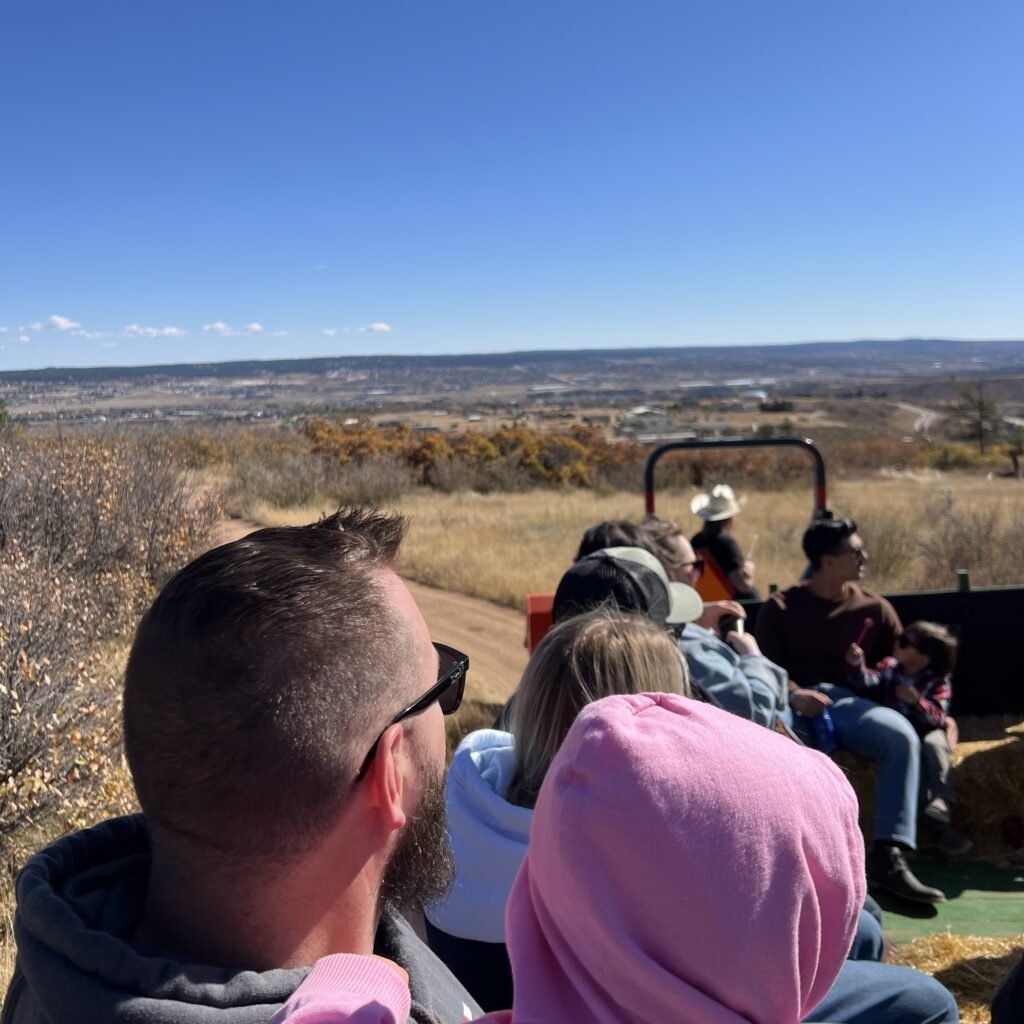 On the hayride at Fall Mountain Farm for our pumpkin patch family tradition.