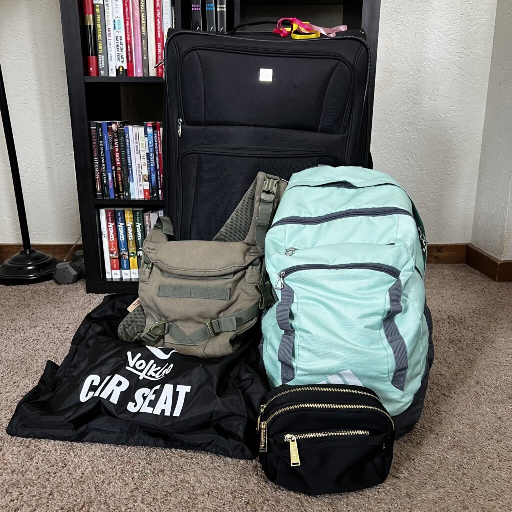 A picture of luggage all packed up and ready to go. A strategy for what to take when flying solo with a toddler.