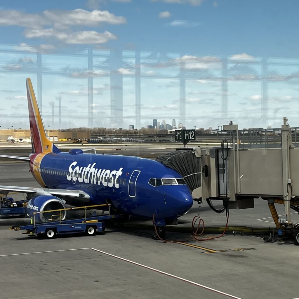 A Southwest Airlines jet sitting at the jet bridge in Minneapolis St. Paul, MN.