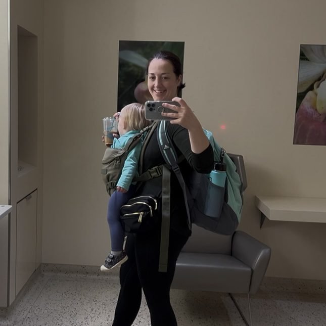 A good packing strategy for flying with a toddler is making sure you can be hands free after checking your larger luggage.