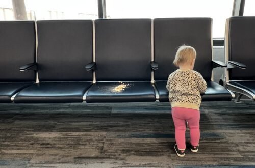 In the Colorado Springs airport with a toddler, making messes, and waiting to board the plane.