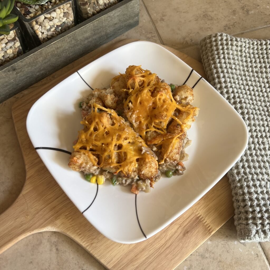 A plate full of fresh baked tater tot hot dish.