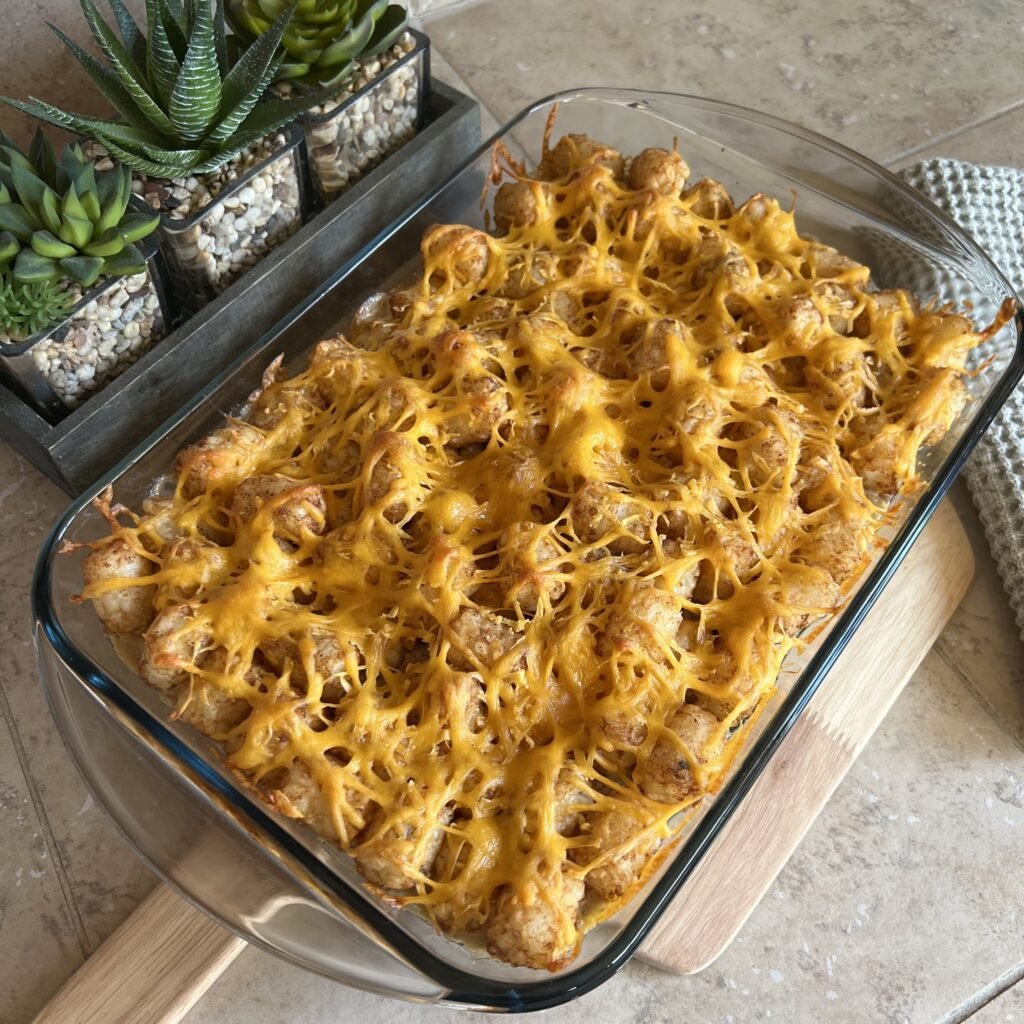 A warm, delicious, and crispy tater tot casserole fresh out of the oven. A comforting family dinner.