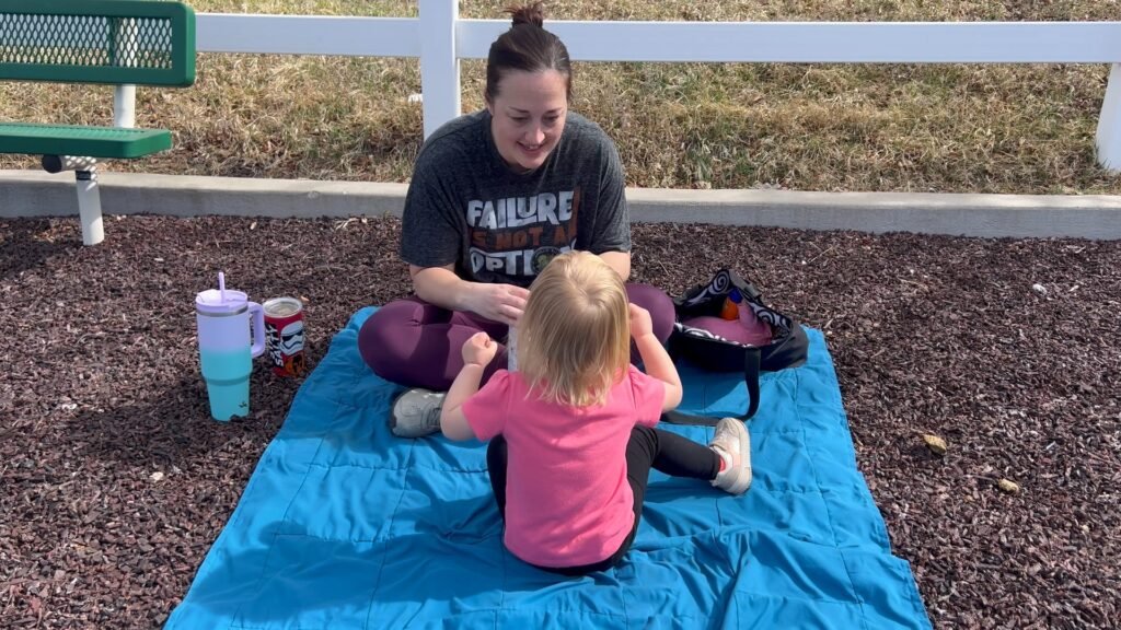 A mom finding rest and refreshment with her toddler. Have more fun as a mom.